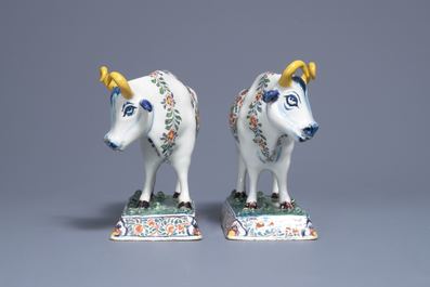 A pair of polychrome Dutch Delft models of cows on bases with frogs, 18th C.