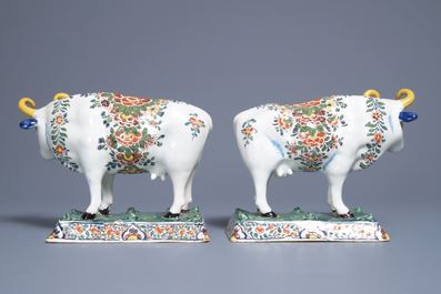 A pair of polychrome Dutch Delft models of cows on bases with frogs, 18th C.