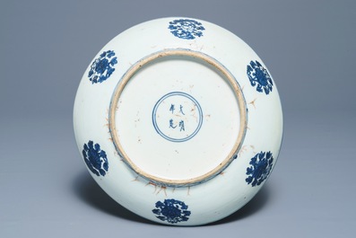 A Chinese blue and white 'dragon and cranes' charger, Jiajing