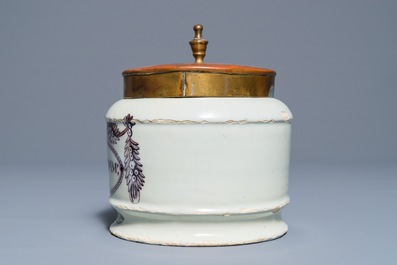 A polychrome Dutch Delft drug jar with brass lid, early 19th C.