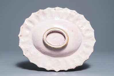 An Italian maiolica gadrooned oval monochrome white dish, Faenza, 17th C.