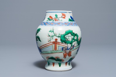 A Chinese wucai baluster vase with figures in a garden, Transitional period