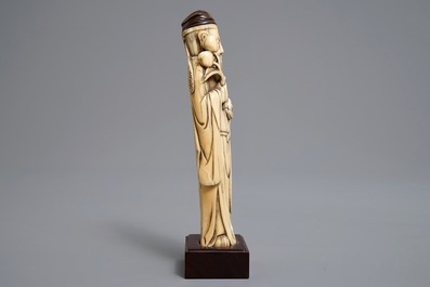 A Chinese Ming style carved ivory figure of a scholar, 19th C.