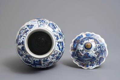 A Chinese clobbered blue and white vase and cover with landscape design, Kangxi