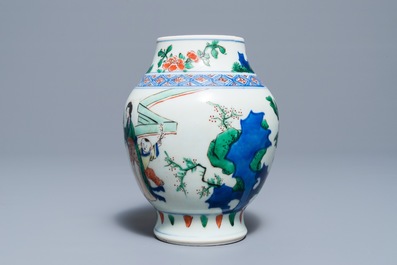 A Chinese wucai baluster vase with figures in a garden, Transitional period