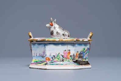 A polychrome Dutch Delft petit feu and dor&eacute; butter tub with a reclining cow, 19th C.