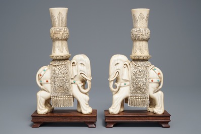 A pair of Chinese coral- and turquoise inlaid ivory elephant candlesticks, 19th C.