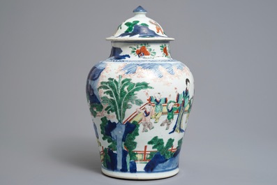 A Chinese wucai baluster vase and cover with playing boys, Transitional period