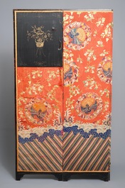 A Chinese folding screen with silk embroidery of phoenixes on a red ground, Qianlong
