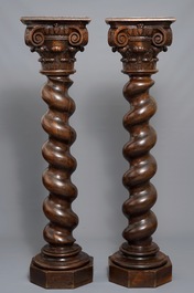 A pair of carved oak twisted pillars with Corinthian capitals, 18th C.