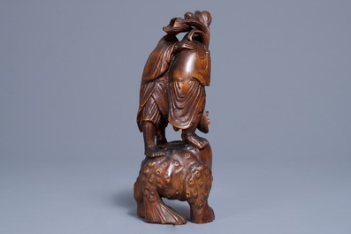 A Chinese carved bamboo group of Liu Hai and the toad, 18/19th C.