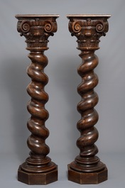 A pair of carved oak twisted pillars with Corinthian capitals, 18th C.