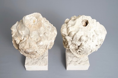 A pair of architectural stone ornaments with cherub's heads and garlands, 18th C.