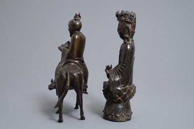 A Chinese bronze Guanyin and a group with a scholar riding a donkey, Ming and later