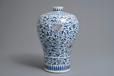 A Chinese blue, white and underglaze red 'lotus scroll' meiping vase, 19/20th C.