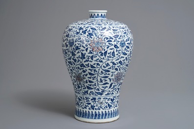 A Chinese blue, white and underglaze red 'lotus scroll' meiping vase, 19/20th C.