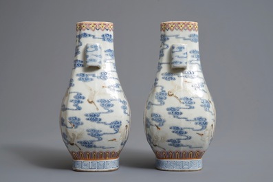 A pair of Chinese famille rose fanghu vases with cranes, Qianlong marks, 19/20th C.