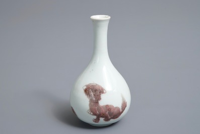 A Chinese copper-red bottle vase with mythical creatures, Kangxi