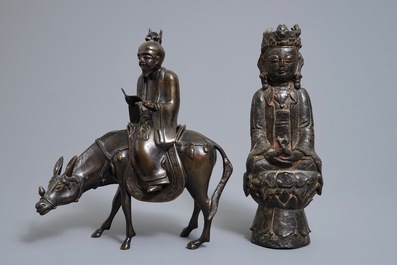 A Chinese bronze Guanyin and a group with a scholar riding a donkey, Ming and later