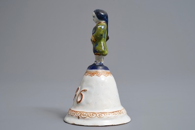 A polychrome Dutch Delft table bell with a nobleman, dated 1796