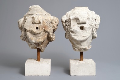 A pair of architectural stone ornaments with cherub's heads and garlands, 18th C.