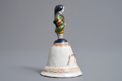 A polychrome Dutch Delft table bell with a nobleman, dated 1796