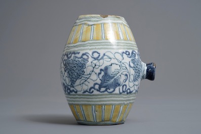 A polychrome Dutch Delft barrel-shaped gin flask with grape vines, 18th C.
