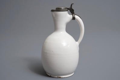 A white Dutch Delft jug with pewter cover, 17th C.