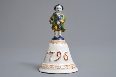 A polychrome Dutch Delft table bell with a nobleman, dated 1796