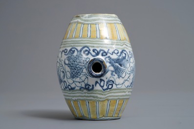 A polychrome Dutch Delft barrel-shaped gin flask with grape vines, 18th C.