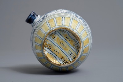 A polychrome Dutch Delft barrel-shaped gin flask with grape vines, 18th C.