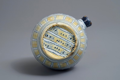 A polychrome Dutch Delft barrel-shaped gin flask with grape vines, 18th C.