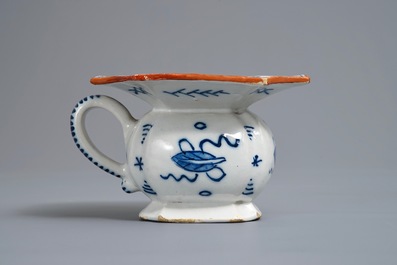 A Dutch Delft blue and white chinoiserie spittoon, 18th C.
