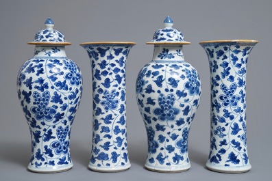 A Chinese blue and white four-piece garniture with floral design, Kangxi