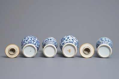 A Chinese blue and white four-piece garniture with floral design, Kangxi