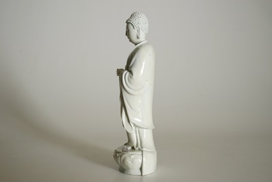 A Chinese Dehua blanc de Chine model of a standing Buddha, impressed mark on the back, Kangxi