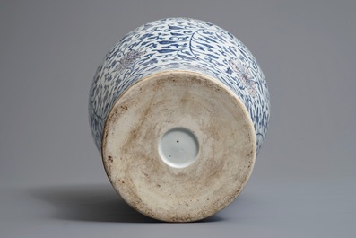 A Chinese blue, white and underglaze red 'lotus scroll' meiping vase, 19/20th C.