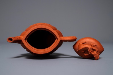A Chinese Yixing stoneware wine jug with applied flowers and buffalo, Kangxi