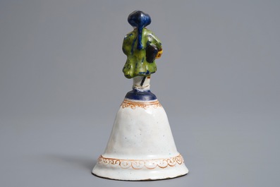 A polychrome Dutch Delft table bell with a nobleman, dated 1796