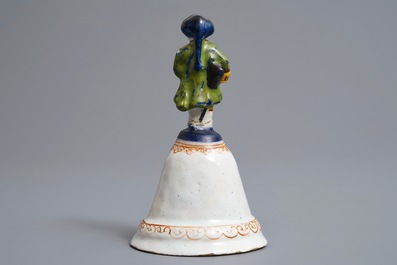 Une cloche de table en fa&iuml;ence polychrome de Delft, dat&eacute;e 1796