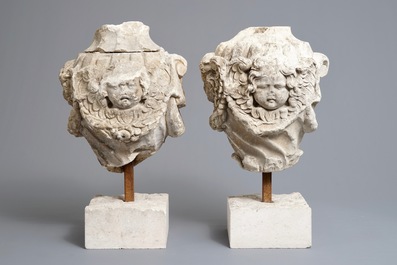 A pair of architectural stone ornaments with cherub's heads and garlands, 18th C.