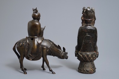 A Chinese bronze Guanyin and a group with a scholar riding a donkey, Ming and later