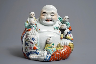 A Chinese famille rose figure of Buddha, 19/20th C.