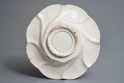 A white Dutch Delft gadrooned dish, 17th C.