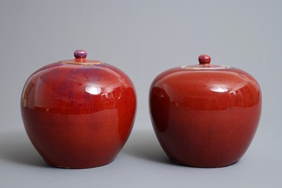 A pair of Chinese monochrome oxblood-glazed jars and covers, 19th C.