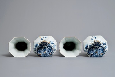 A Dutch Delft blue and white five-piece garniture with birds of paradise, 18th C.