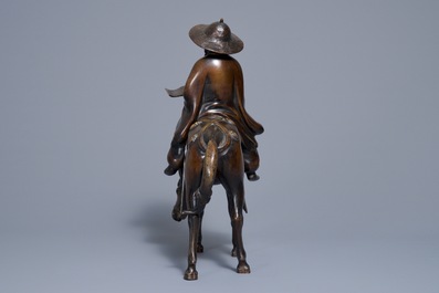 A large Japanese bronze group of a sage on horseback, Meiji, 19th C.