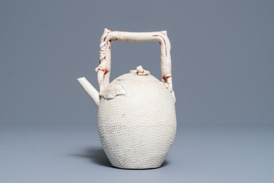 A Chinese biscuit 'conjoined peach' teapot and cover, Kangxi/Yongzheng