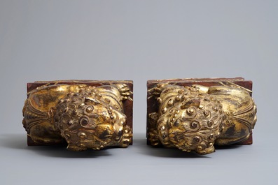 A pair of Chinese gilt-laquered wood Buddhist lions, 19th C.