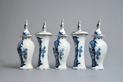 A Dutch Delft blue and white five-piece garniture with birds of paradise, 18th C.